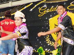 Miss June Fauga and Mr. Sam Lulai during their crowning taualuga (first traditional dance) 