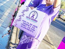 Some of the local residents, all dressed in purple at Alzheimer's month wave