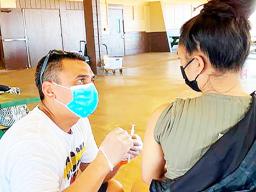 Dr. Kapono Chong-Hanssen administers COVID-19 vaccines