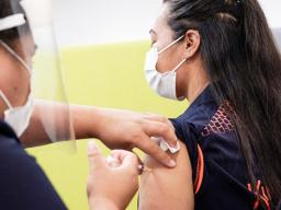 Woman getting a vaccination