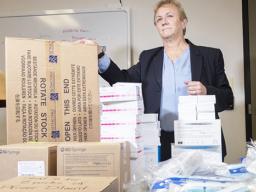 Official with vaccine kits