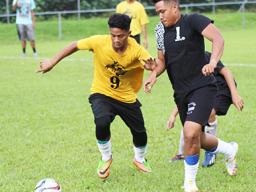 A Pago Youth player (left) and Tafuna Jets opponent 