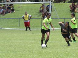 A Pago Youth player controls the ball against a Taputimu defender