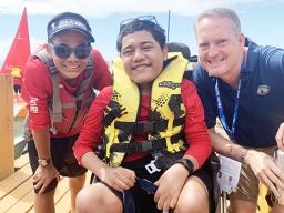 Alofaeleuma Faualo (center) with his crew 11-year old Laser Sailor Carneal Lili’o Satele and Tony Greubel, Charge de Affaires for the US Embassy