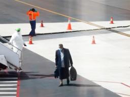Passenger getting off Air New Zealand plane