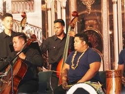 Some members of the Samoa National Orchestra with the Pate drum