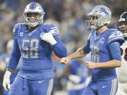  Penei Sewell (58) and quarterback Jared Goff