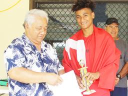 Petu Pouli of Vaiala Tongan’s Boys 13-15 team receives his MVP award