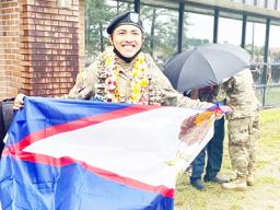 PFC Castro with American Samoa flag