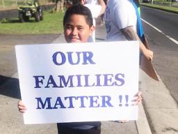 Young demonsrator at Saturday's rally for stranded residents.