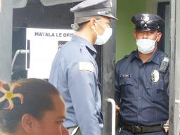 The two police officers exiting DHSS office