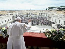 Pope Francis waves to an estimated 70,000 people