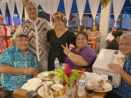 Taimalelagi Dr. Claire Poumele (right-standing), posing with others