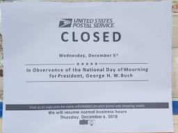 Sign at Post Office saying closed for National Day of Mourning 