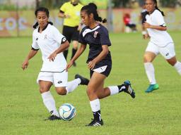 Precious Ieremia of American Samoa dribbles away