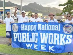 Dept. of Public Works staffers waving