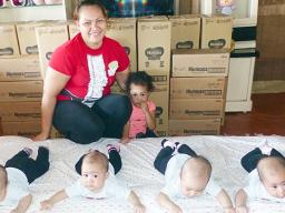 Maureen 12-pounds, Mariya 10-pounds, Melisha 12-pounds and Miracle 11-pounds with their mother and older sister