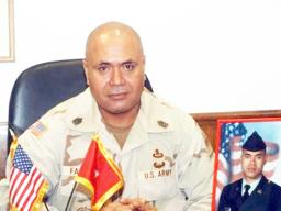 CSM retired Faleniko with a photo of his son, Jonathan.