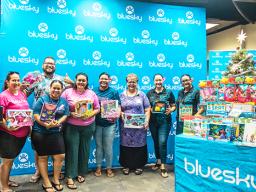 Rotaract members with donated toys