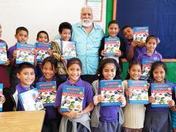 Rotary Club of Pago Pago vice president, Peter Tinitali presented dictionaries to the 3rd graders of Siliaga Elementary School. 
