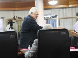 Deputy AG Roy Hall shaking hands 