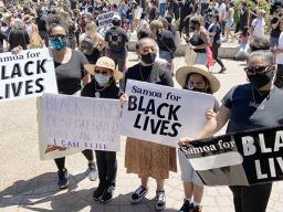 Leiataua Family members with Samoa for Black Lives Matter signs