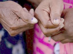 Voters showing the mark indicating they had voted