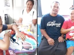 Two of Samoa's Christmas babies with parents