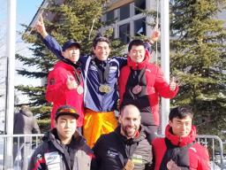 Nathan Crumpton top center in an ie lavalava with his medals