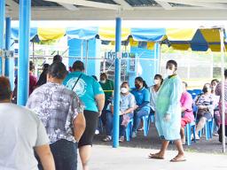 Parents picking up food coupons at Samoana H.S.