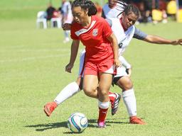 Saono Enesi of American Samoa dribbles the ball