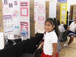  A 2022-23 Science Fair participant with her exhibit