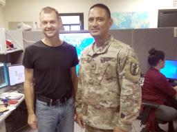 Scott Rozanski (left) in Weather Service office with another staff member