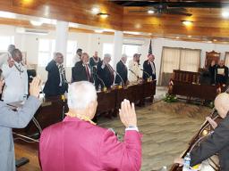 Senators raise their hands during the swearing-in ceremony