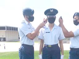 Serenalia May Iona (middle) receiving her sholder boards.