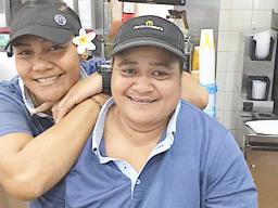 Two smiling McDonald's servers