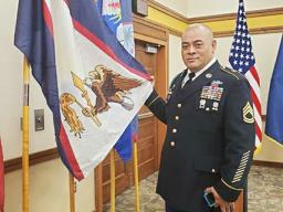  SFC Samasoni Lele’a with the American Samoa flag