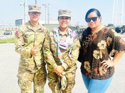 GT Andrea Faaleiua Asuao with two others