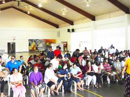 People seated waiting for their turn to get covid vaccination