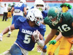 Samoana Sharks Marcus Samia storming down field 