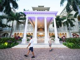 People maintaining social distancing on Thursday in front of the Moana Surfrider Hotel in Waikiki