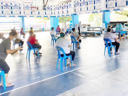 Parents picking up food coupons at Samoana H.S.