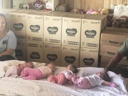 Mrs. Filomena Sokimi (far left) and Sokimi Sokimi Jr. (far right) of Ili’ili with the four baby girls