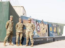 Spc. Miguel A. Martinez, Pvt. 1st Class Janice M. Salazar, and Spc. Onosai Misionare