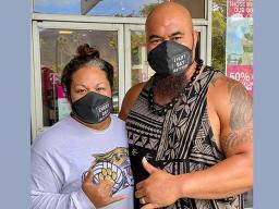 Isaac and Mrs Sopoaga with protective masks on 