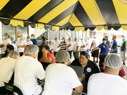 Health Department medical personnel giving measles shots to StarKist Samoa workers