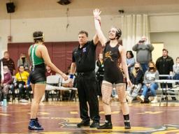 Stephanie Floor (far right) winning one of her wresting tournaments