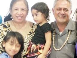 Rep. Su’a Alexander Eli Jennings (right), pictured with his wife and children