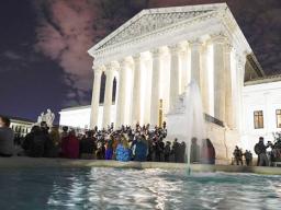 People gather at the Supreme Court Friday, Sept. 18, 2020, in