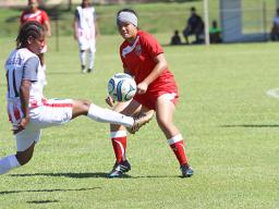 Susanna Lutali makes a pass with a New Caledonia opponent